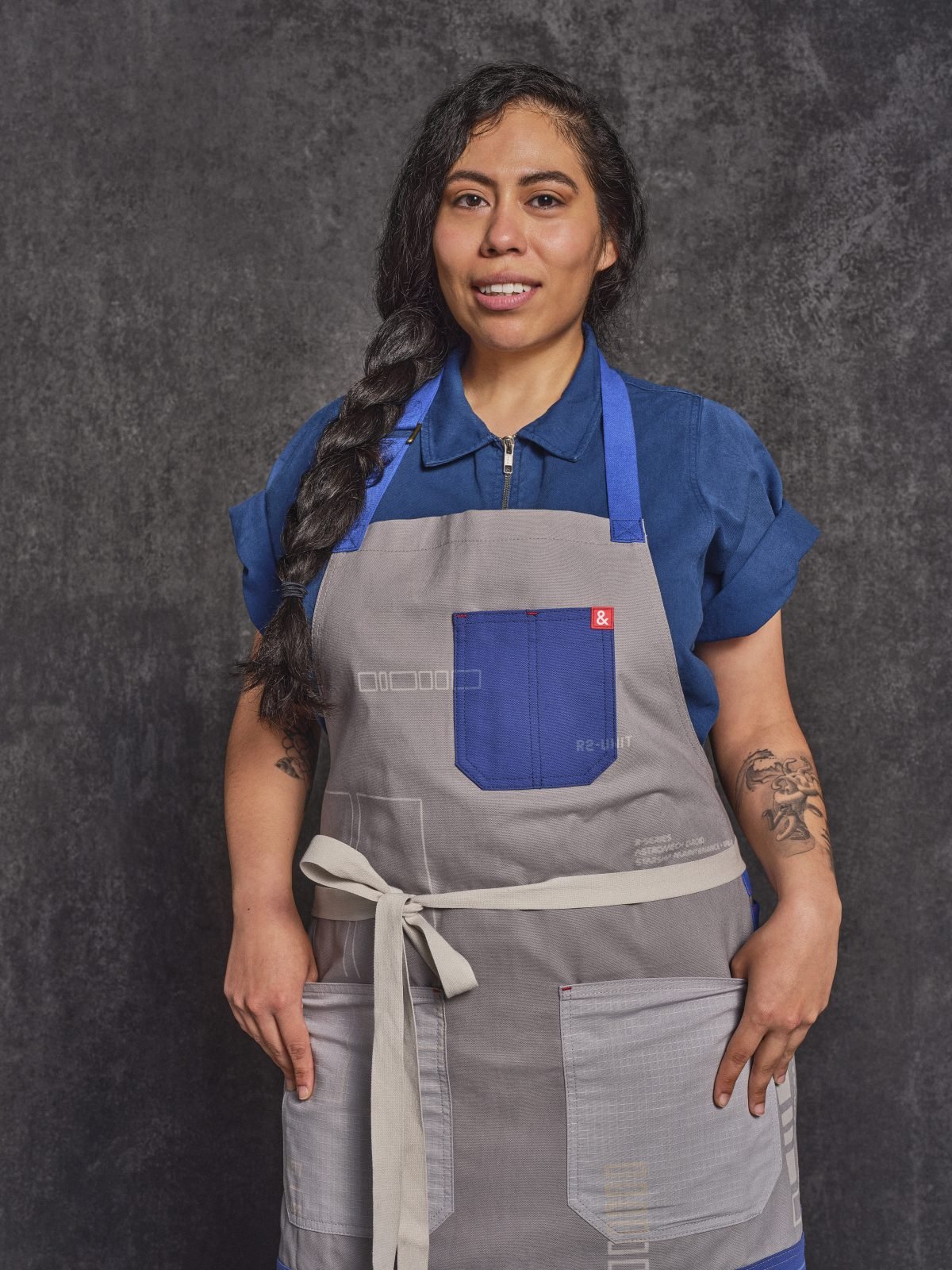 A person wearing an R2-D2 apron