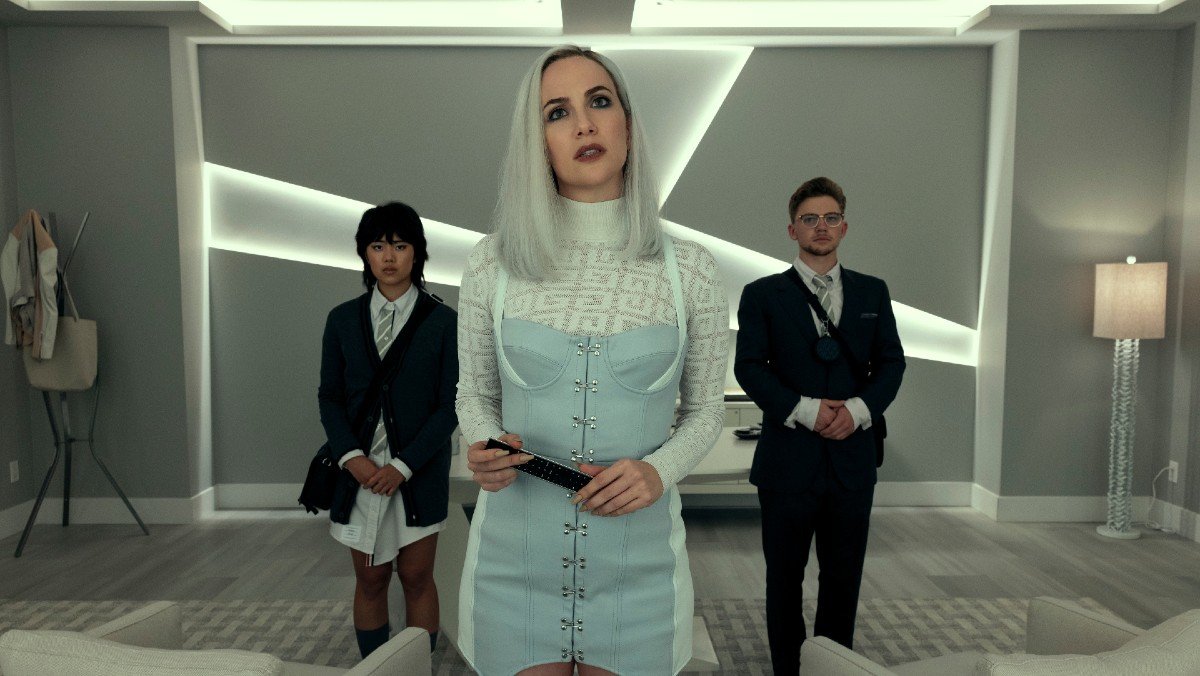 Camille Usher with white hair and blue dress in fall of house of Usher for Netflix ad-tier update article
