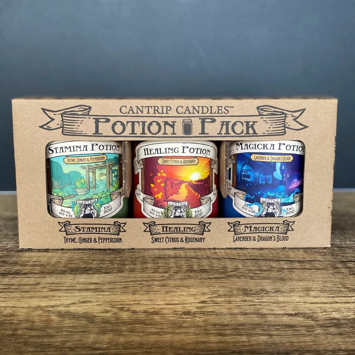 A package containing three of Cantrip Candles tabletop roleplaying-inspired candles
