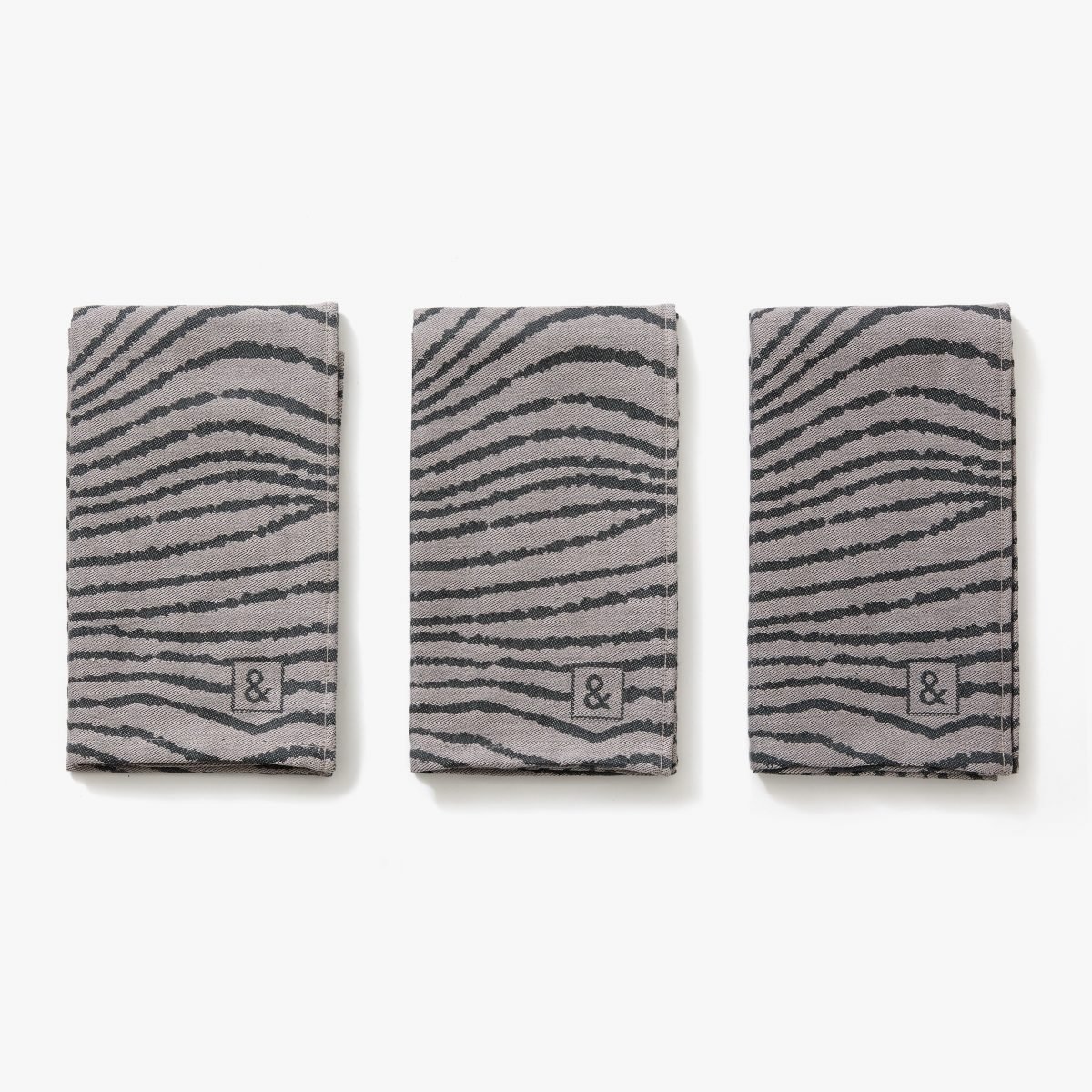 A trio of kitchen towels that look like beskar