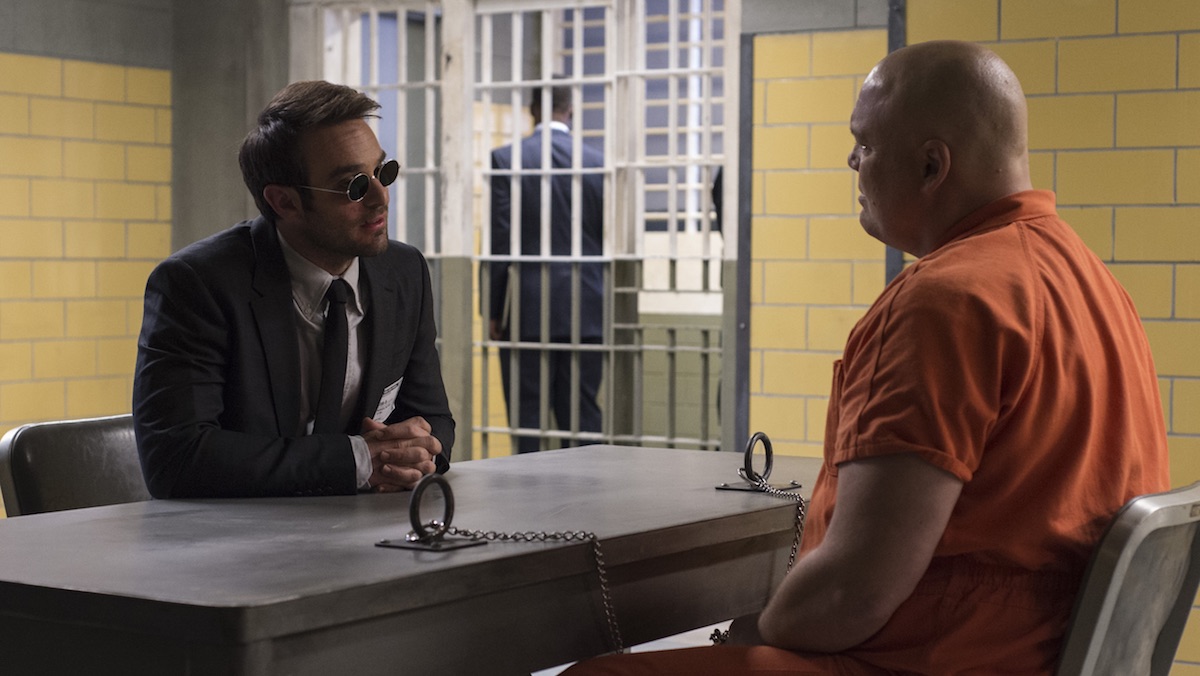 Charlie Cox's Matt Murdoch talks to Vincent D'Onfrio's Kingpin while he's locked up in jail on Daredevil. Daredevil actors D'Onofrio and Cox. may appear next on Echo.