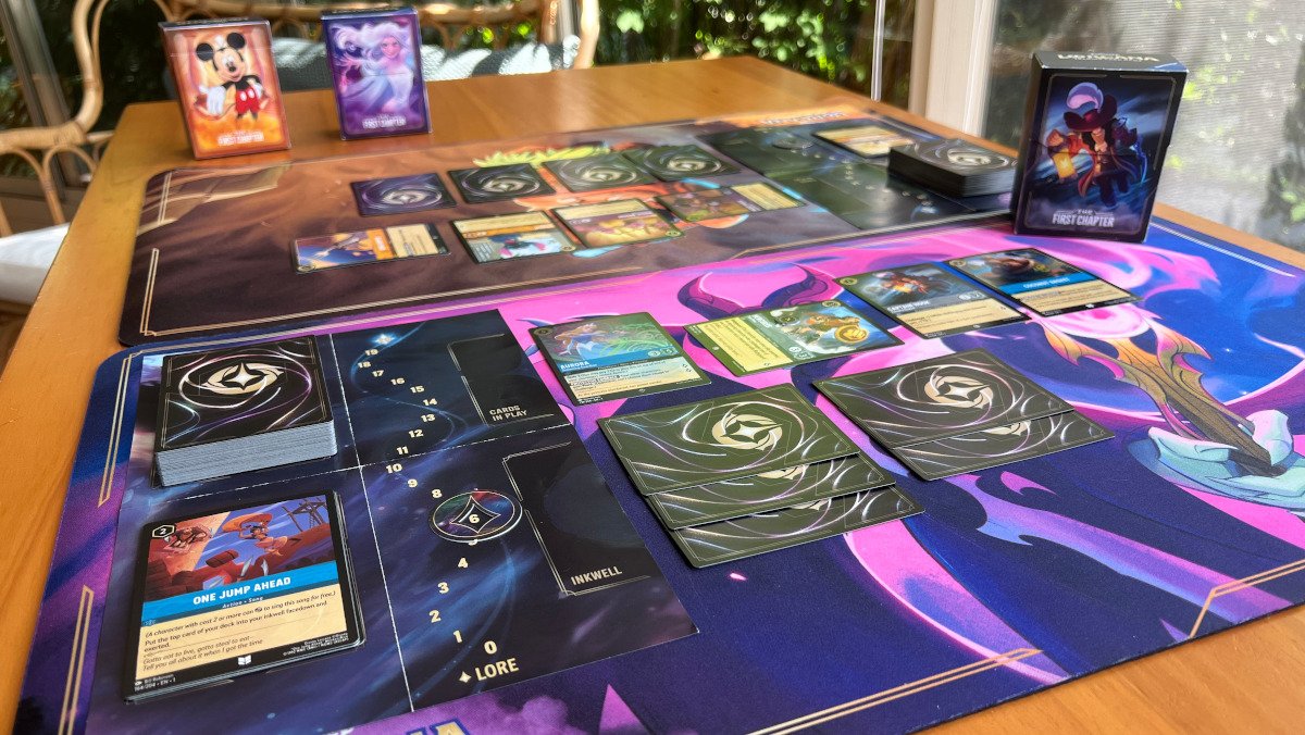 Two Lorcana playmats with the cards set up