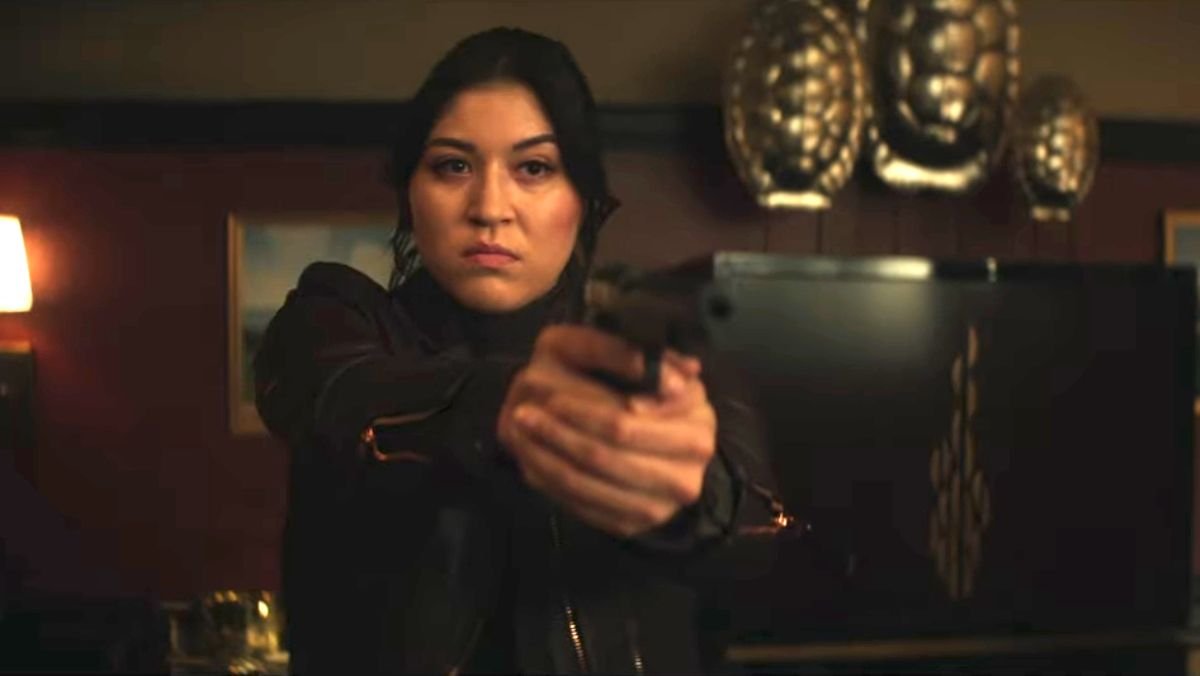 Echo's Maya Lopez holding a gun in the trailer