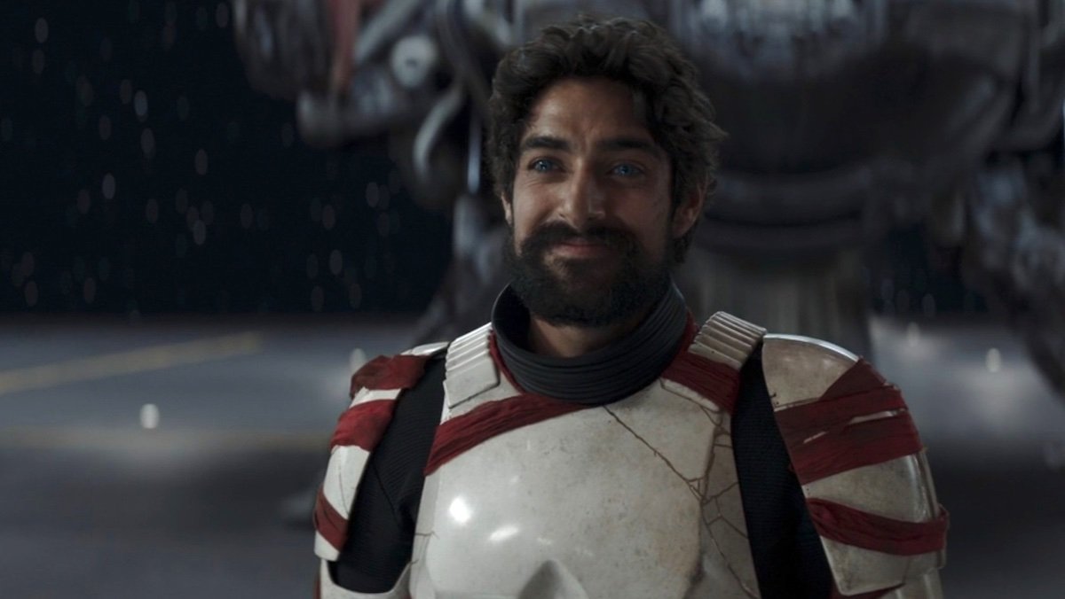 A smiling Ezra Bridger in night trooper armor on Ahsoka