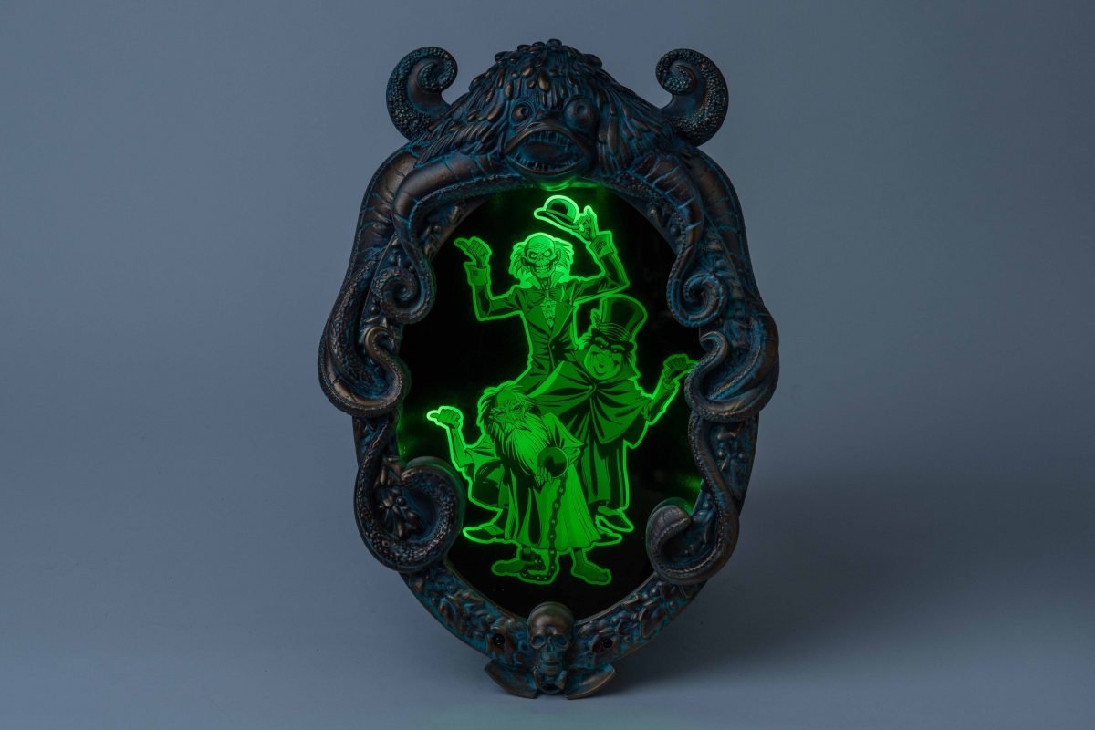 The Haunted Mansion parlor mirror with the hitchhiking ghosts in the center
