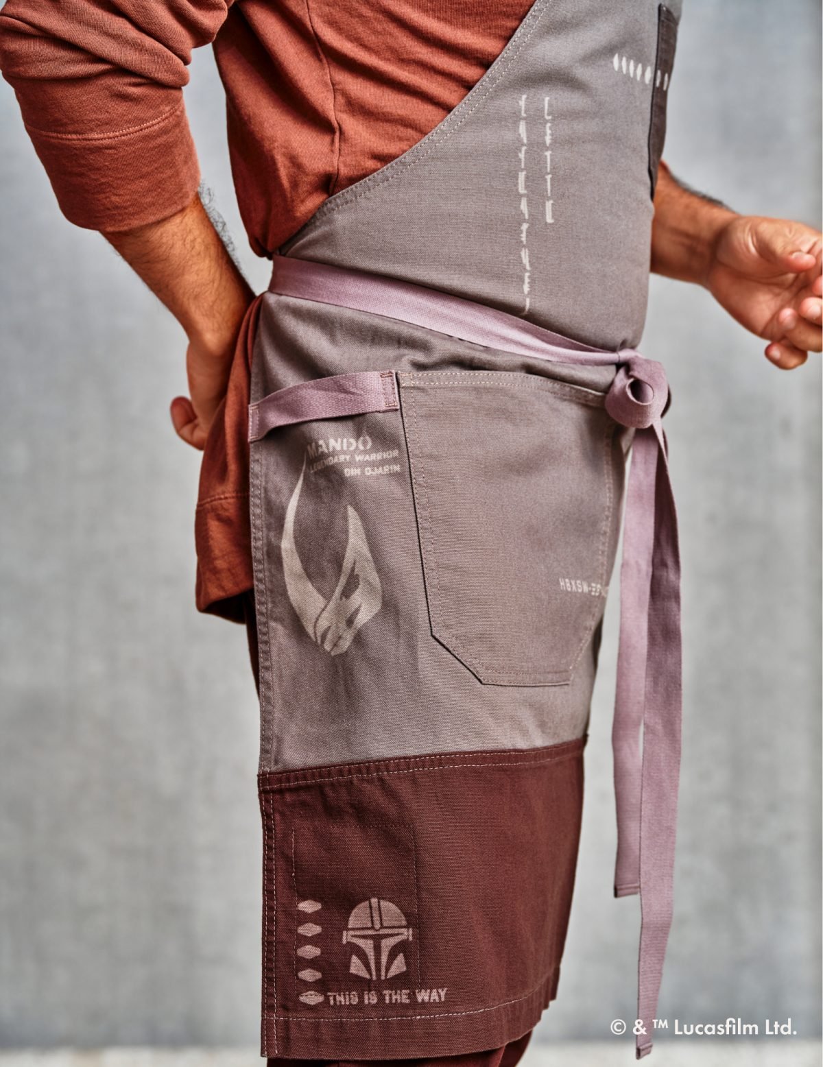 A person wearing a Mandalorian apron
