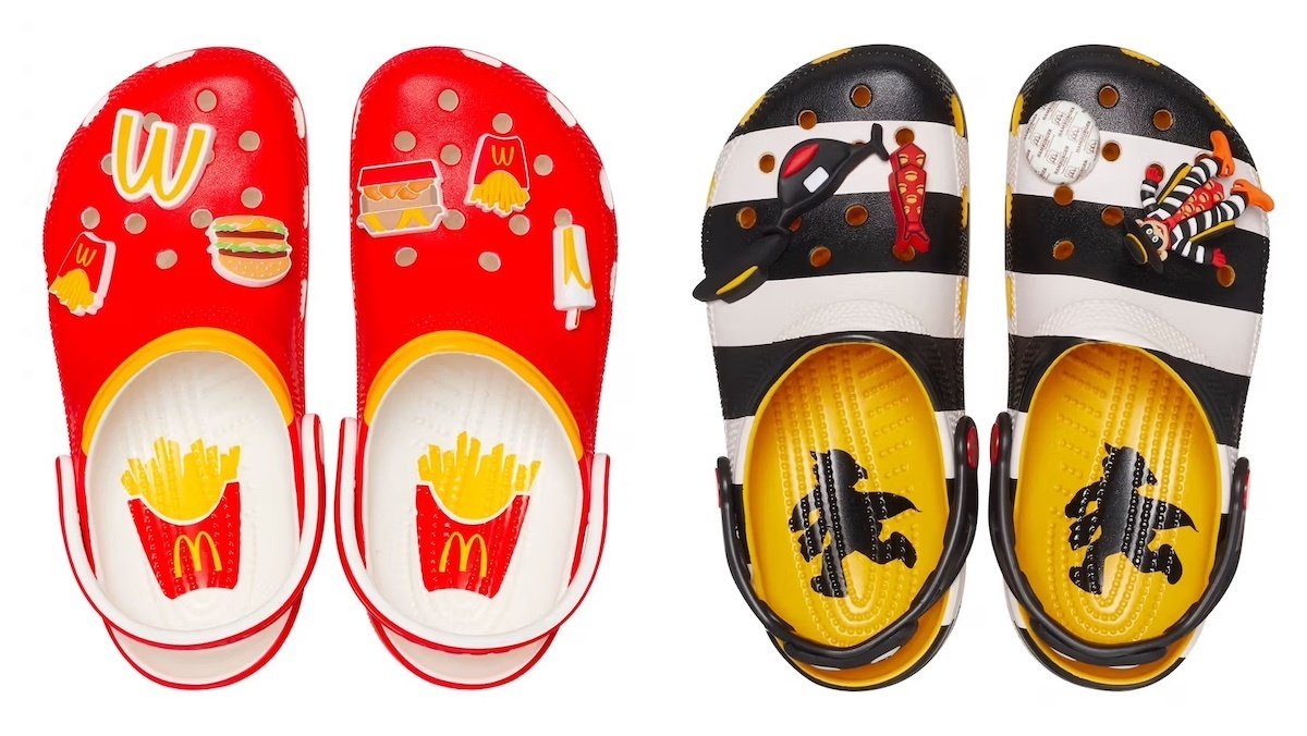 Red and yellow McDonald's Crocs upright next to an upright pair of Black-and-white striped Hamburglar McDonald's Crocs 