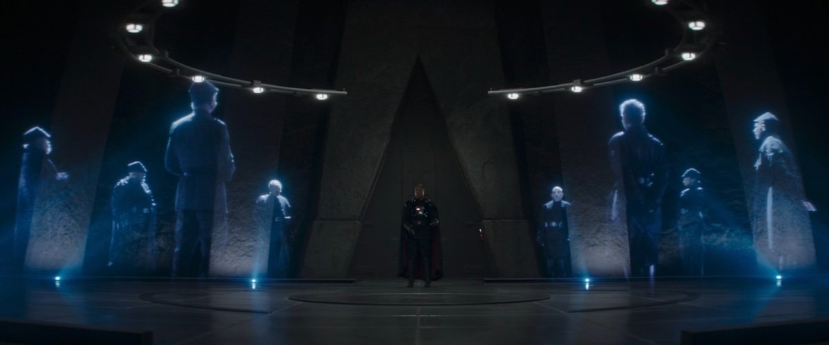 Moff Gideon stands in the middle of eight holograms during a Shadow Council meeting on The Mandalorian