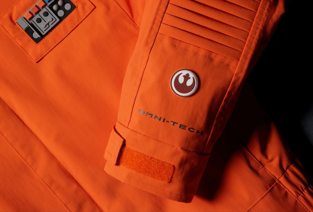 A detail of a Star Wars Rebel logo on an orange Columbia Star Wars ski suit